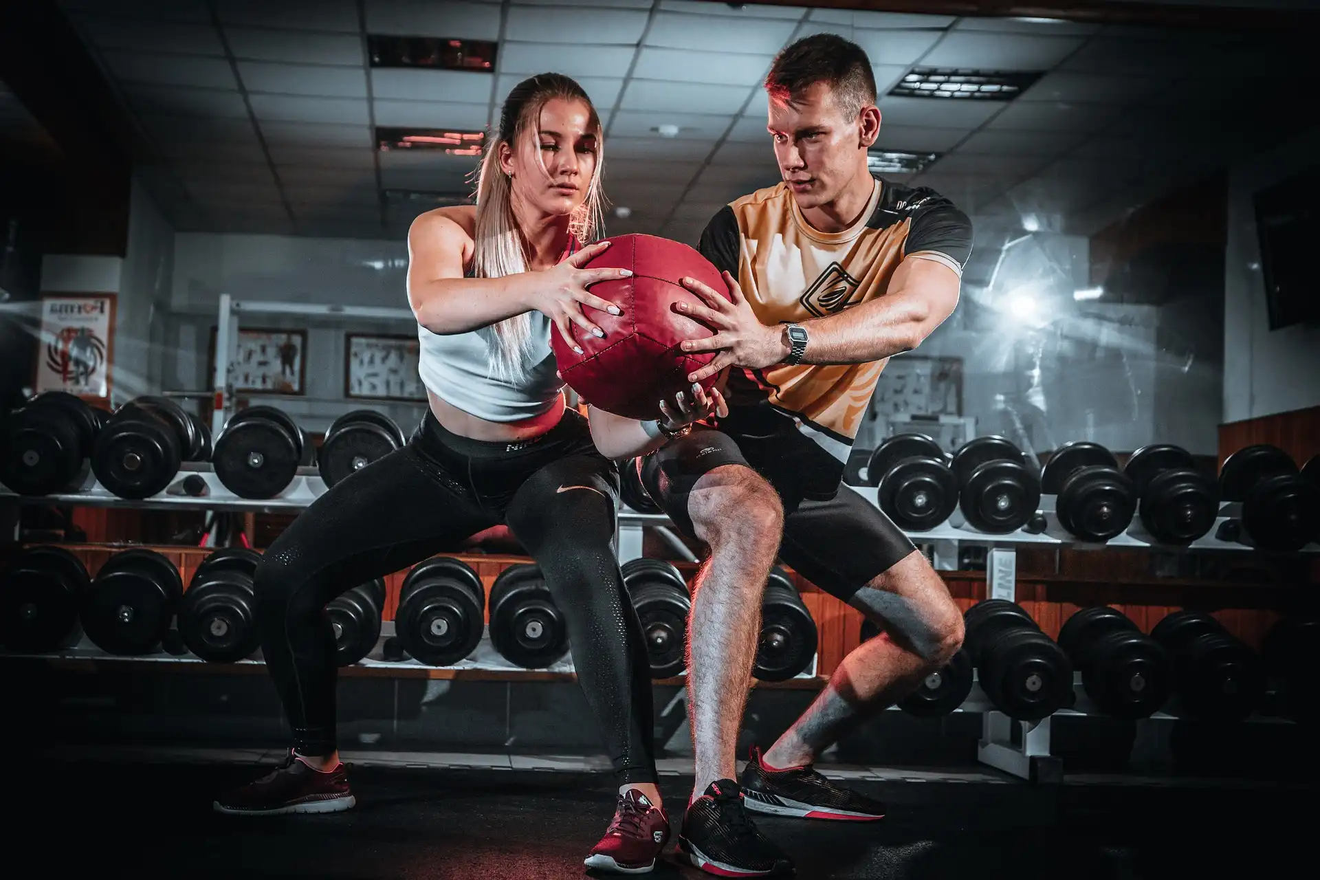 fitness couple holding a ball