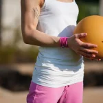 a fitness boy holding a ball