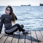 a girl sit onthe beach