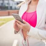 fitness girl holding mobile