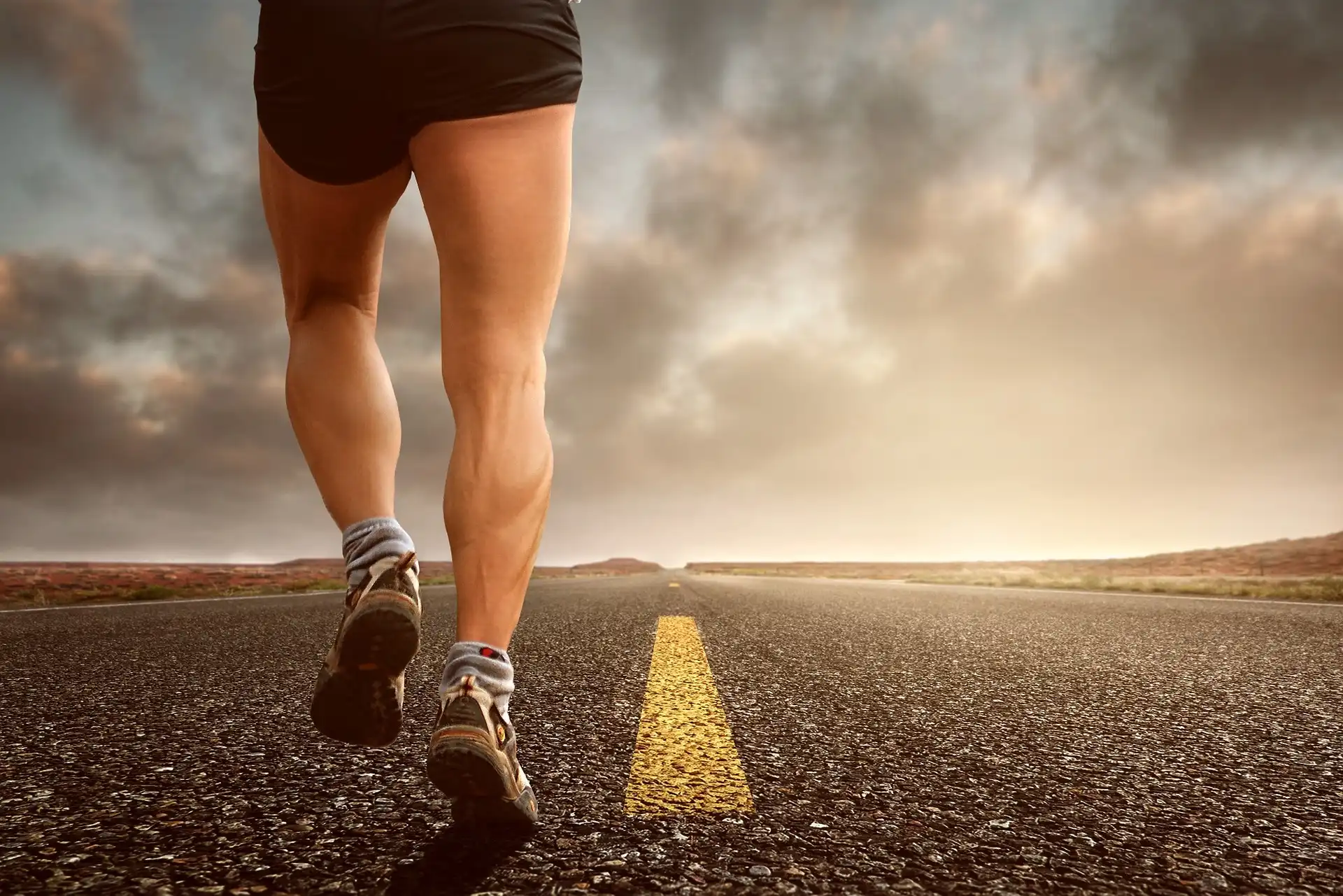 man walking on the road alone