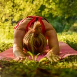 woman yoga on the grasses